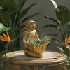 Figura Mono Dorado con Recipiente